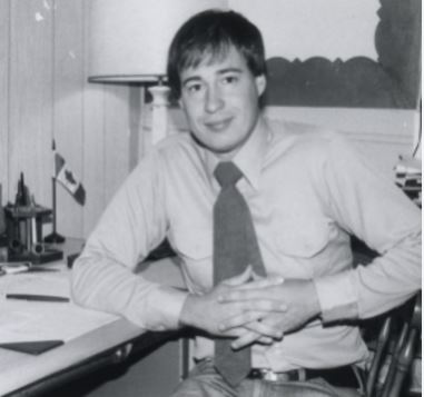 Dr. Ted Karamanski sits at a desk